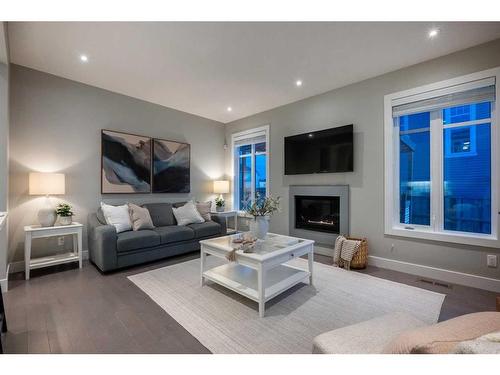 44 Windford Park Sw, Airdrie, AB - Indoor Photo Showing Living Room With Fireplace