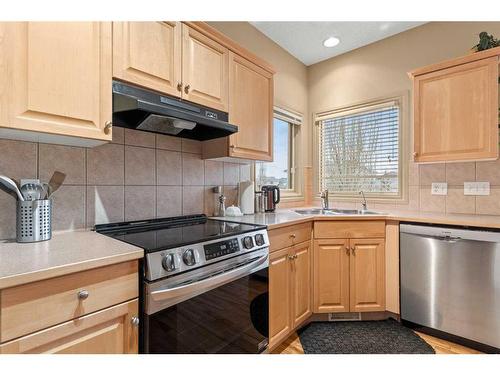 144 Oakmere Place, Chestermere, AB - Indoor Photo Showing Kitchen With Double Sink