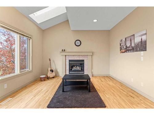 144 Oakmere Place, Chestermere, AB - Indoor Photo Showing Living Room With Fireplace