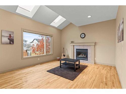 144 Oakmere Place, Chestermere, AB - Indoor Photo Showing Living Room With Fireplace