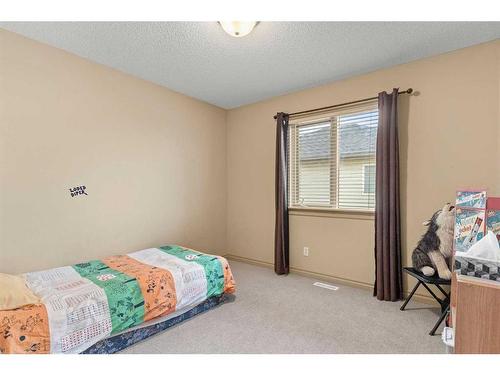 144 Oakmere Place, Chestermere, AB - Indoor Photo Showing Bedroom