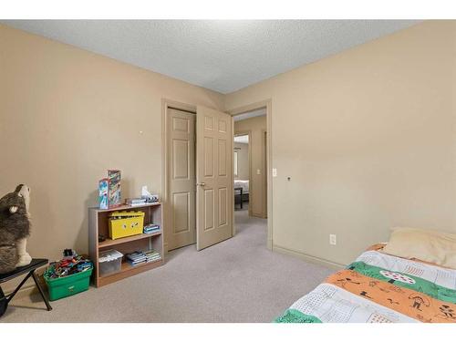 144 Oakmere Place, Chestermere, AB - Indoor Photo Showing Bedroom