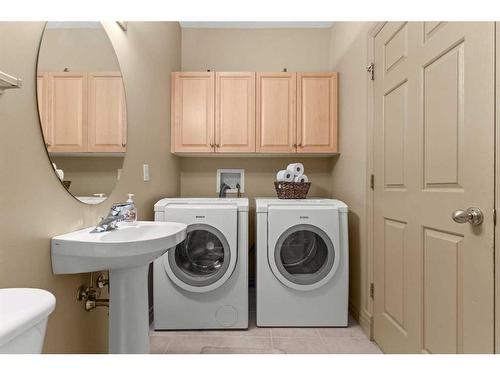 144 Oakmere Place, Chestermere, AB - Indoor Photo Showing Laundry Room