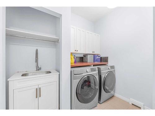 108 West Pointe Manor, Cochrane, AB - Indoor Photo Showing Laundry Room