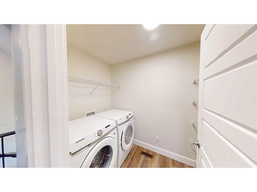 123 Saddlebred Link, Cochrane, AB - Indoor Photo Showing Laundry Room