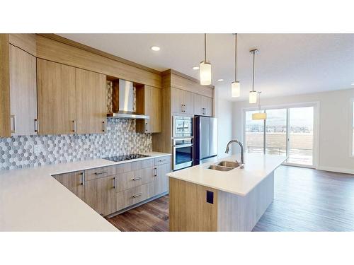 123 Saddlebred Link, Cochrane, AB - Indoor Photo Showing Kitchen With Double Sink With Upgraded Kitchen