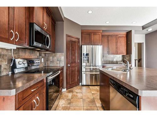 113 Brightoncrest Grove Se, Calgary, AB - Indoor Photo Showing Kitchen With Double Sink