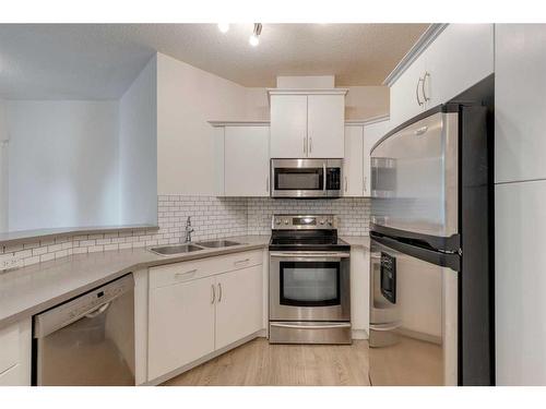 319-10 Discovery Ridge Close Sw, Calgary, AB - Indoor Photo Showing Kitchen With Double Sink