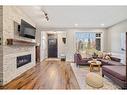 4512 16A Street Sw, Calgary, AB  - Indoor Photo Showing Living Room With Fireplace 