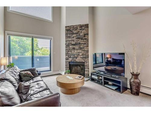 106-1817 14A Street Sw, Calgary, AB - Indoor Photo Showing Living Room With Fireplace