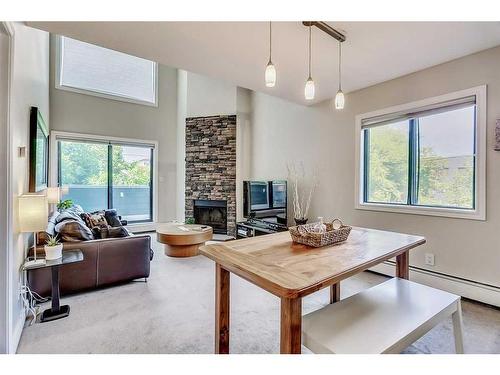 106-1817 14A Street Sw, Calgary, AB - Indoor Photo Showing Living Room With Fireplace