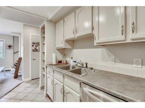 106-1817 14A Street Sw, Calgary, AB - Indoor Photo Showing Kitchen With Double Sink