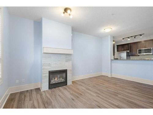 202-518 33 Street Nw, Calgary, AB - Indoor With Fireplace