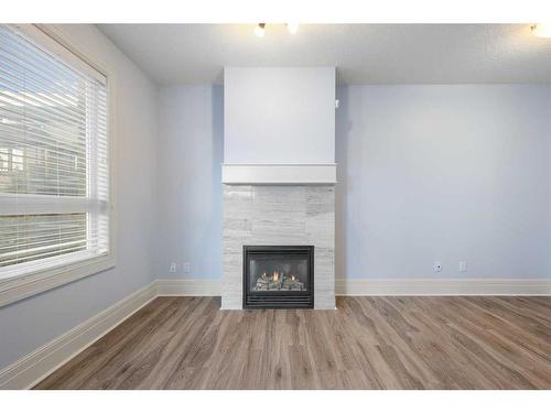 202-518 33 Street Nw, Calgary, AB - Indoor With Fireplace