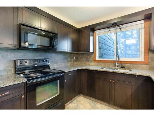 312-315 50 Avenue Sw, Calgary, AB - Indoor Photo Showing Kitchen With Double Sink