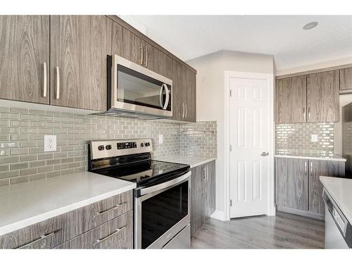 41 Hillcrest Square Sw, Airdrie, AB - Indoor Photo Showing Kitchen