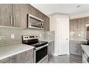 41 Hillcrest Square Sw, Airdrie, AB  - Indoor Photo Showing Kitchen 