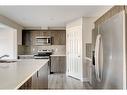 41 Hillcrest Square Sw, Airdrie, AB  - Indoor Photo Showing Kitchen With Stainless Steel Kitchen With Double Sink With Upgraded Kitchen 