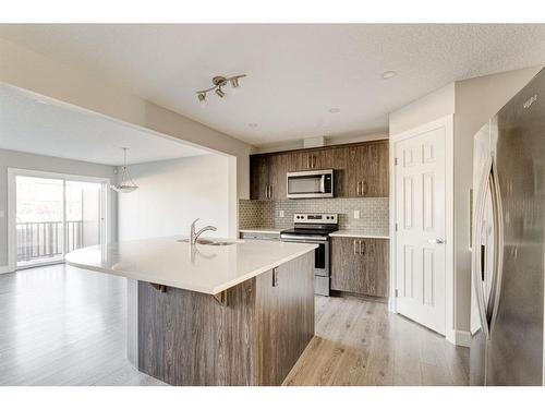 41 Hillcrest Square Sw, Airdrie, AB - Indoor Photo Showing Kitchen With Stainless Steel Kitchen With Upgraded Kitchen