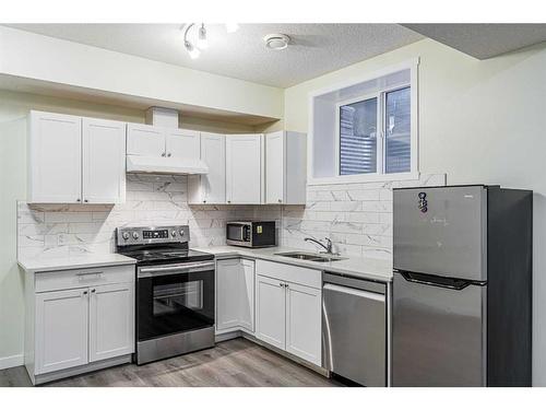 412 Legacy Boulevard Se, Calgary, AB - Indoor Photo Showing Kitchen With Stainless Steel Kitchen With Double Sink