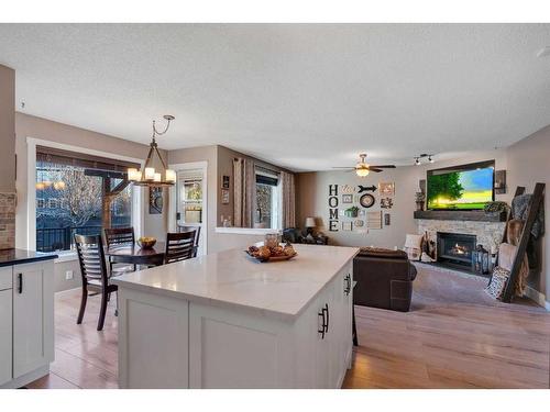 141 Somerset Way Sw, Calgary, AB - Indoor Photo Showing Other Room With Fireplace