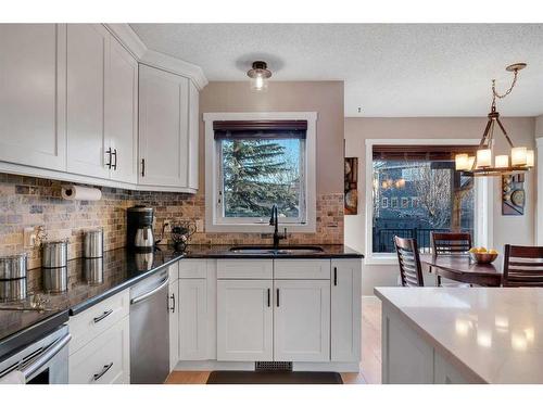 141 Somerset Way Sw, Calgary, AB - Indoor Photo Showing Kitchen With Double Sink With Upgraded Kitchen