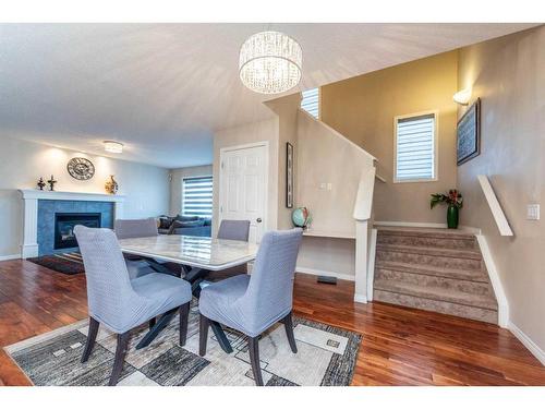 43 Evanston Rise Nw, Calgary, AB - Indoor Photo Showing Dining Room With Fireplace