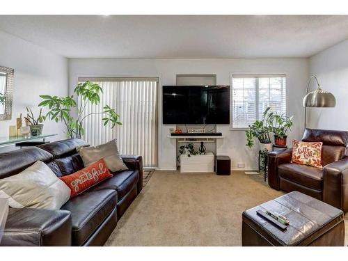 66 Country Village Villas Ne, Calgary, AB - Indoor Photo Showing Living Room