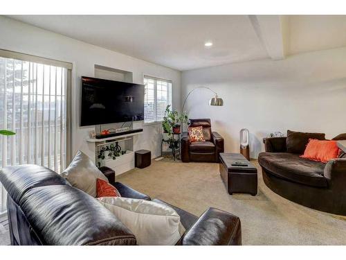 66 Country Village Villas Ne, Calgary, AB - Indoor Photo Showing Living Room