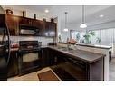 66 Country Village Villas Ne, Calgary, AB  - Indoor Photo Showing Kitchen With Double Sink 