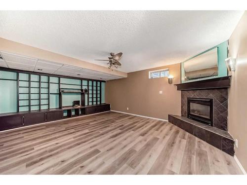 218 Taracove Place Ne, Calgary, AB - Indoor With Fireplace