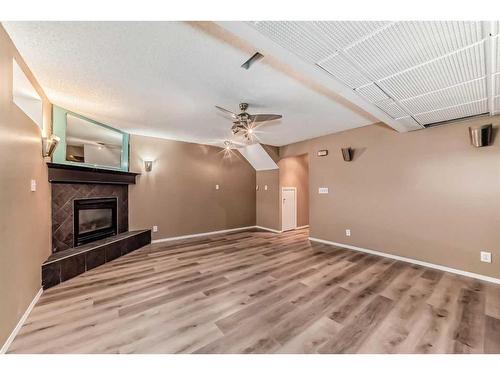 218 Taracove Place Ne, Calgary, AB - Indoor Photo Showing Other Room With Fireplace