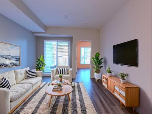 203-730 5 Street Ne, Calgary, AB - Indoor Photo Showing Living Room