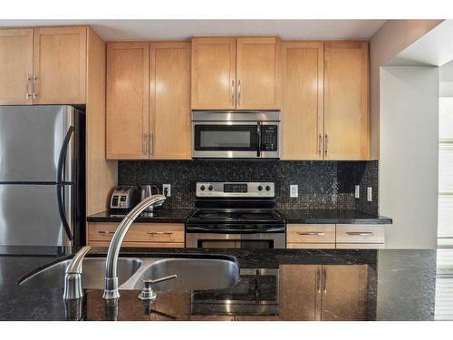 333 Aspen Hills Villas Sw, Calgary, AB - Indoor Photo Showing Kitchen With Stainless Steel Kitchen With Double Sink