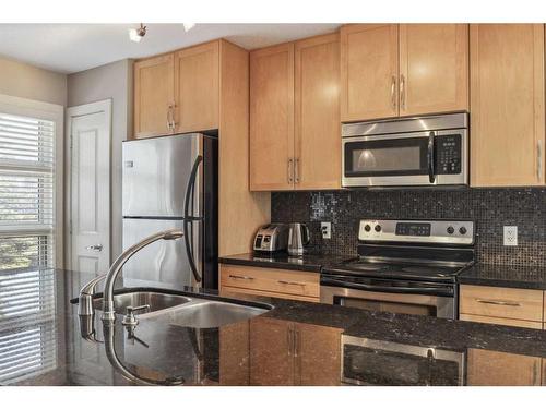 333 Aspen Hills Villas Sw, Calgary, AB - Indoor Photo Showing Kitchen With Stainless Steel Kitchen With Double Sink