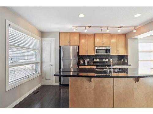 333 Aspen Hills Villas Sw, Calgary, AB - Indoor Photo Showing Kitchen With Stainless Steel Kitchen With Double Sink