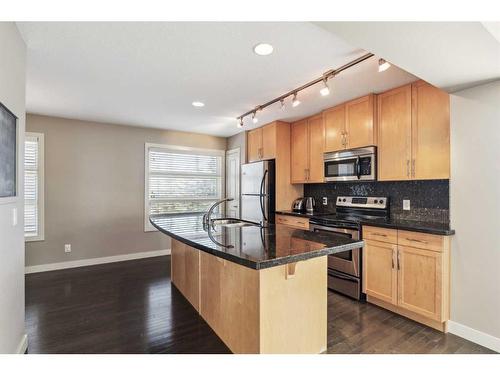 333 Aspen Hills Villas Sw, Calgary, AB - Indoor Photo Showing Kitchen With Stainless Steel Kitchen