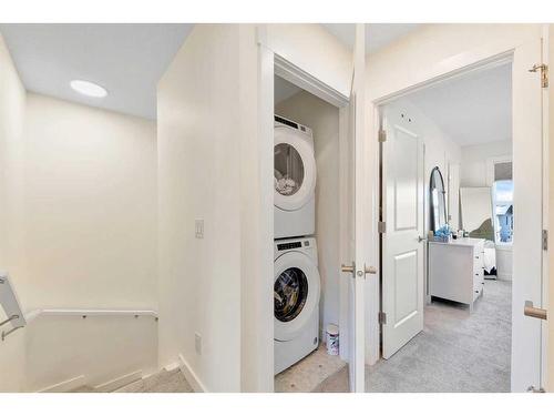 109-525 River Heights Drive, Cochrane, AB - Indoor Photo Showing Laundry Room