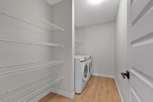 32 Ranchers View, Okotoks, AB - Indoor Photo Showing Laundry Room