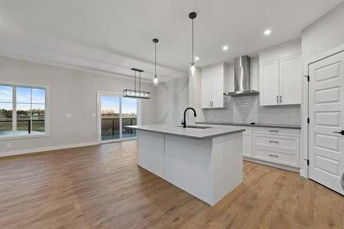 32 Ranchers View, Okotoks, AB - Indoor Photo Showing Kitchen With Upgraded Kitchen