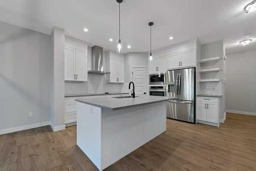 32 Ranchers View, Okotoks, AB - Indoor Photo Showing Kitchen With Upgraded Kitchen