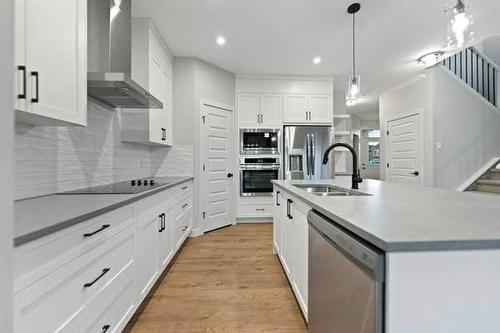 32 Ranchers View, Okotoks, AB - Indoor Photo Showing Kitchen With Double Sink With Upgraded Kitchen