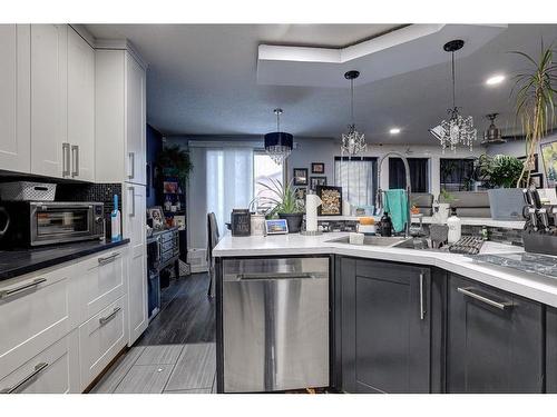 15 Glenpatrick Crescent, Cochrane, AB - Indoor Photo Showing Kitchen With Double Sink With Upgraded Kitchen