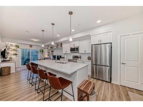 104-200 Harvest Hills Place Ne, Calgary, AB - Indoor Photo Showing Kitchen With Upgraded Kitchen