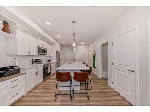 104-200 Harvest Hills Place Ne, Calgary, AB - Indoor Photo Showing Kitchen With Upgraded Kitchen