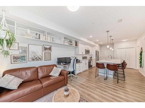 104-200 Harvest Hills Place Ne, Calgary, AB - Indoor Photo Showing Living Room