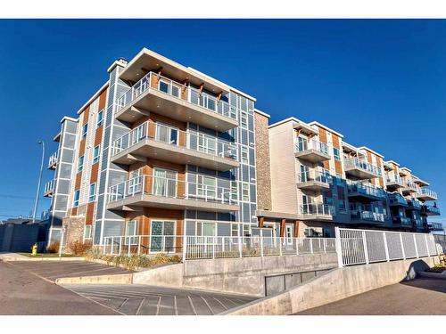 104-200 Harvest Hills Place Ne, Calgary, AB - Outdoor With Balcony With Facade