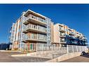 104-200 Harvest Hills Place Ne, Calgary, AB  - Outdoor With Balcony With Facade 