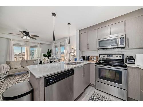 4116-302 Skyview Ranch Drive Ne, Calgary, AB - Indoor Photo Showing Kitchen With Stainless Steel Kitchen With Double Sink