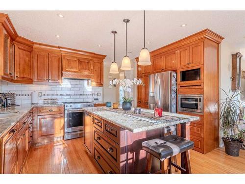 51 Arbour Butte Way Nw, Calgary, AB - Indoor Photo Showing Kitchen With Upgraded Kitchen